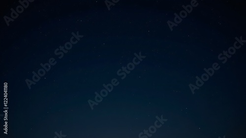 A clear night sky filled with bright, visible constellations such as Orion and the Big Dipper.