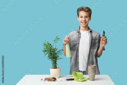 Teenage boy with gardening ...