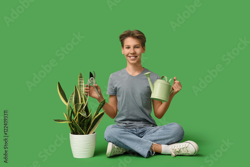 Teenage boy with gardening ...