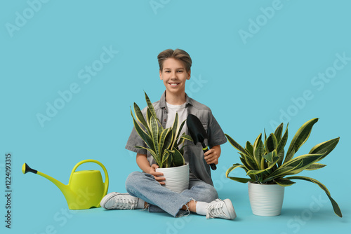 Teenage boy with gardening ...