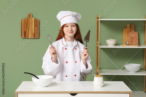 Teenage chef with utensils ...