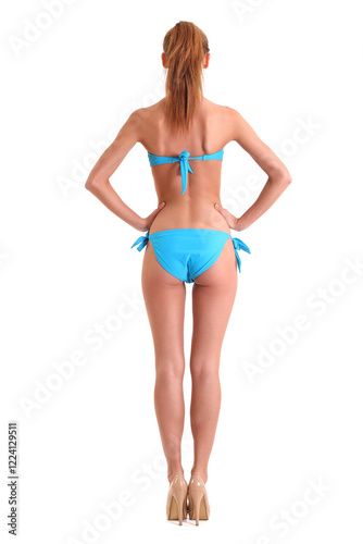 sporty woman in bikini on white background