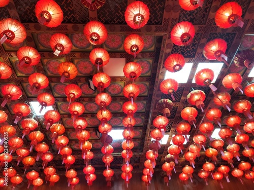 Red Lanterns Ceiling: Hundreds of vibrant red lanterns hang from a ornate ceiling, creating a captivating and festive atmosphere. Perfect for celebrating Lunar New Year, cultural events.