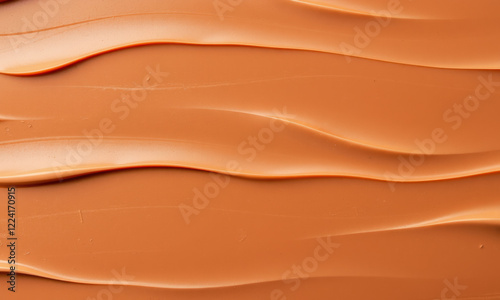 Smooth chocolate surface with wavy texture, rich brown color, and creamy appearance evokes indulgence and sweetness. Perfect for dessert backgrounds or culinary themes photo