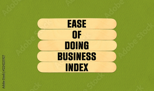 Concept word Ease of Doing Business Index  on beautiful wooden stick. Beautiful Green Chart Paper Background. Business and Ease of Doing Business Index  concept. Copy space