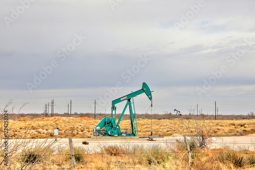 Odessa, Texas - 1-7-25. Oil pumps dot the land of the Permian Basin of Texas. Pulling the fossil fuel from the deep beneath the surface.