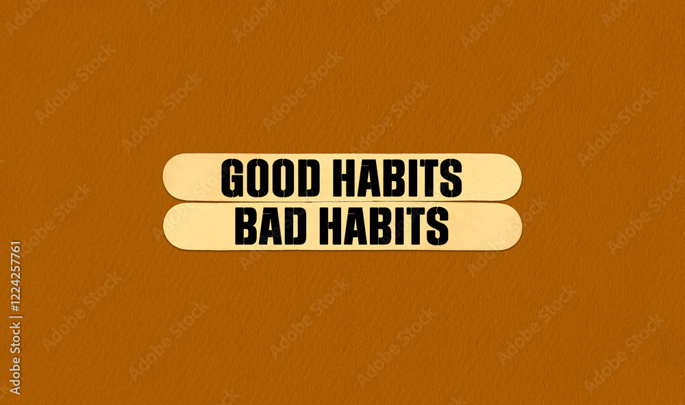 Fototapeta premium Good or Bad Habits Symbol. Concept word Good or Bad Habits on beautiful wooden stick. Beautiful Orange Chart Paper Background. Business and Good or Bad Habits concept. Copy space