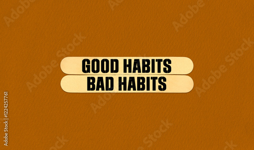 Good or Bad Habits Symbol. Concept word Good or Bad Habits on beautiful wooden stick. Beautiful Orange Chart Paper Background. Business and Good or Bad Habits concept. Copy space