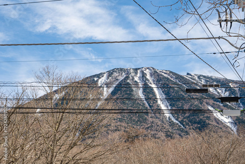 Mount Nantai, the top of the stratovolcano Mt Nantai with a bit of snow outdoor during winter with blue sky and clouds in Nikko National Park in Tochigi Prefecture, in central Honshū of Japan. photo