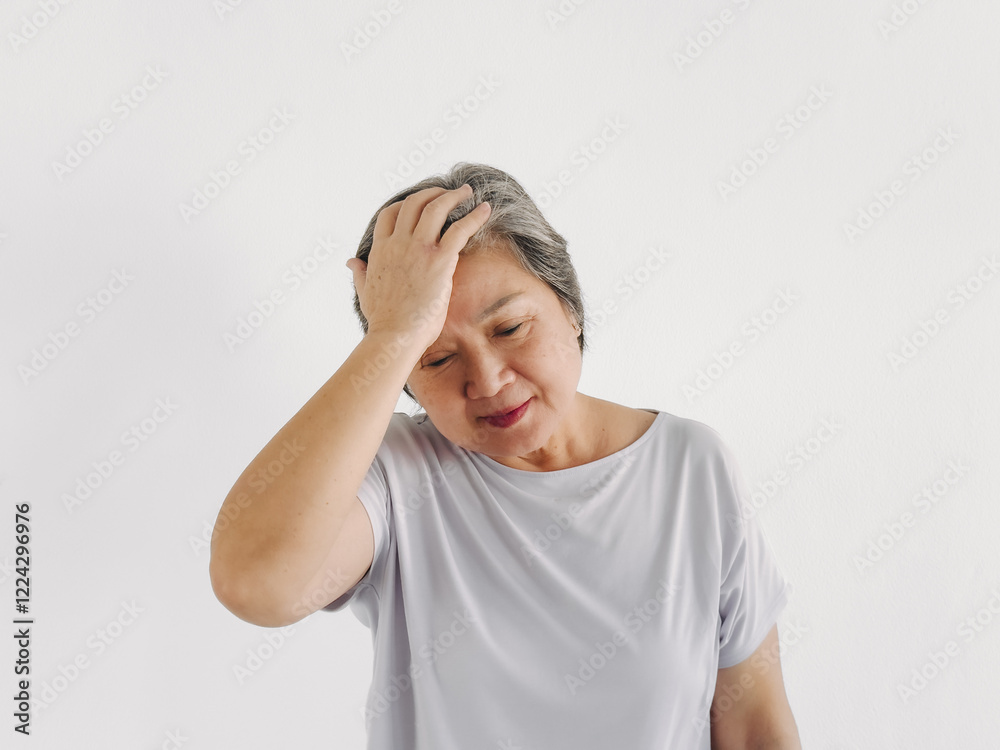 Asian elder woman hand touching head, got headache symptom or get confusing, standing isolated over white background wall. Asian elder woman hand touching head, got headache symptom or get confusing, standing isolated over white background wall.