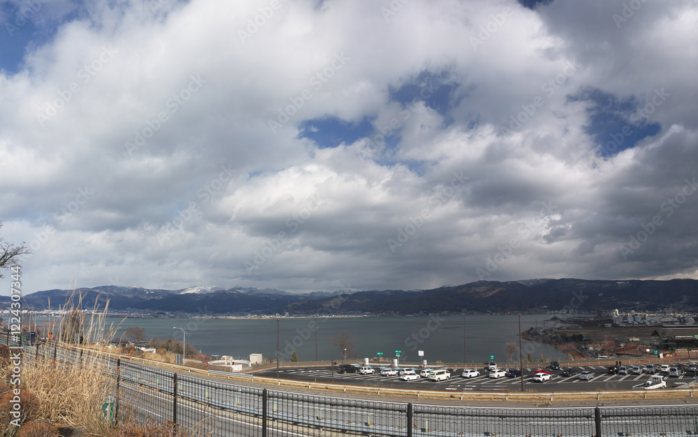 Lake Suwa panoramic view with mountains in background Lake Suwa panoramic view with mountains in background