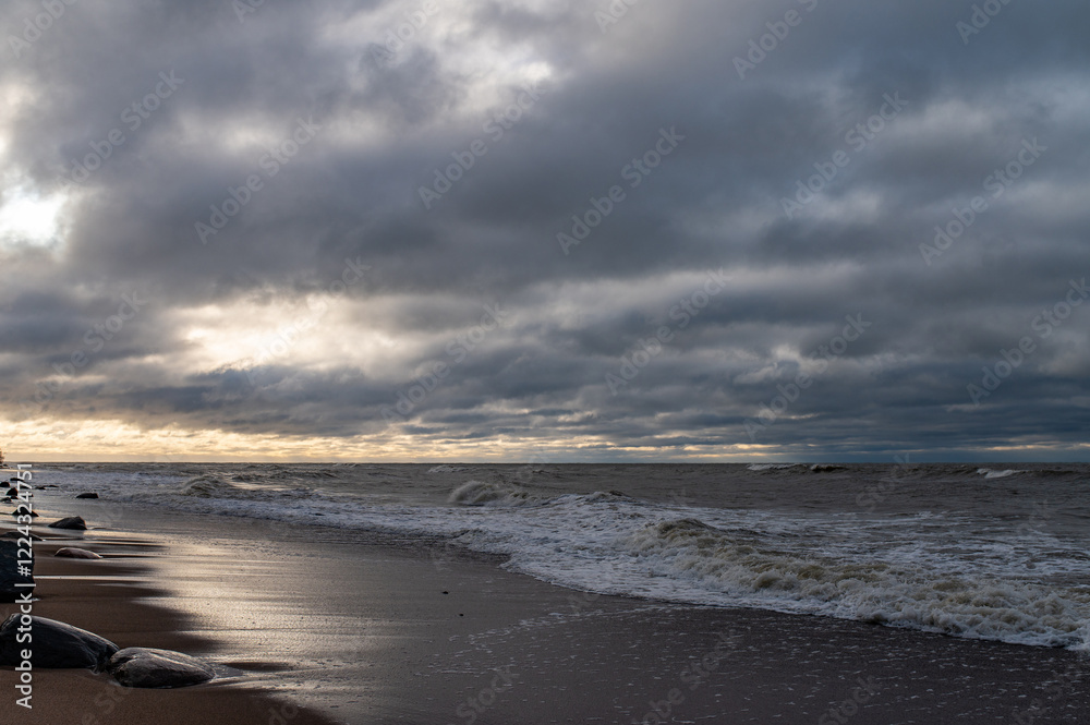 waves breaking on rocks after sunset close Palanga, Lithuania waves breaking on rocks after sunset close Palanga, Lithuania