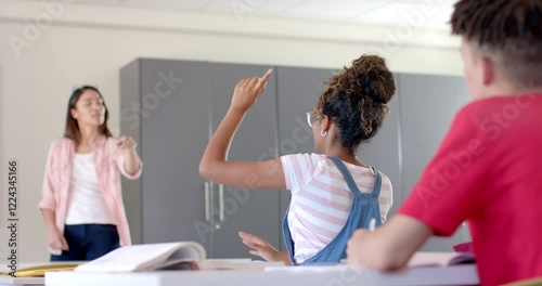 Wallpaper Mural Young biracial woman teaches in a high school classroom Torontodigital.ca