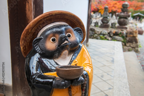 Tanuki Statue in Adashino temple at autumn, Arashiyama, Kyoto photo