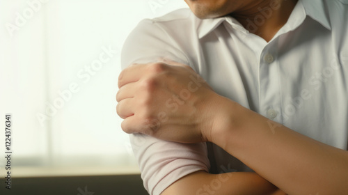 Close-Up of a Person Experiencing Elbow Pain and Discomfort