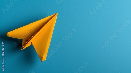A photostock of a cheerful yellow paper plane flying gracefully on a pastel blue background, representing freedom, creativity, and inspiration. High Quality