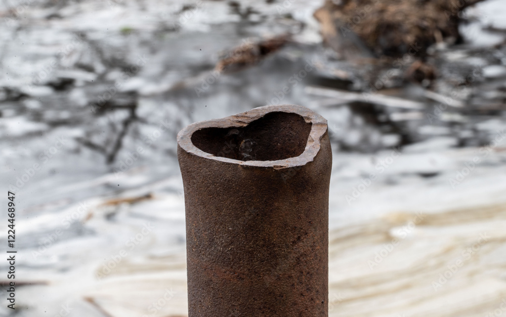 A rusty pipe with a heart cut out of it A rusty pipe with a heart cut out of it