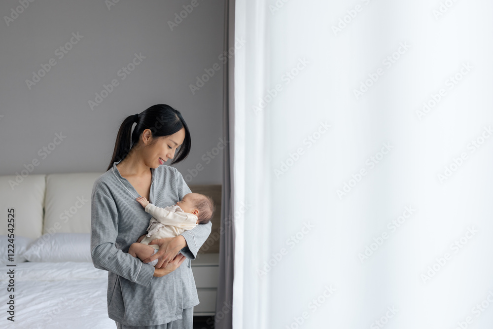 Mother embracing baby at home Mother embracing baby at home