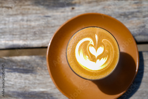 A Cup of coffee latte on wood table. photo