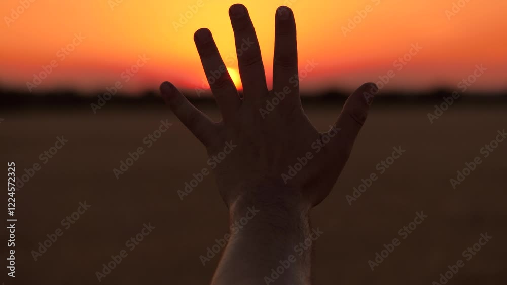 Human hand open palm fingers silhouette at bright sunset sunrise cinematic sun sky dusk field closeup. Arm shadow gesture at picturesque dawn sunlight freedom inspiration nature meadow scenery Human hand open palm fingers silhouette at bright sunset sunrise cinematic sun sky dusk field closeup. Arm shadow gesture at picturesque dawn sunlight freedom inspiration nature meadow scenery
