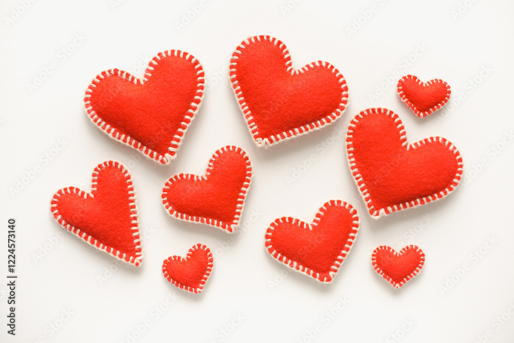 Red hearts on white background. Isolated hearts on white background. Valentine's Day background. Red felt hearts. Red hearts on white background. Isolated hearts on white background. Valentine's Day background. Red felt hearts.