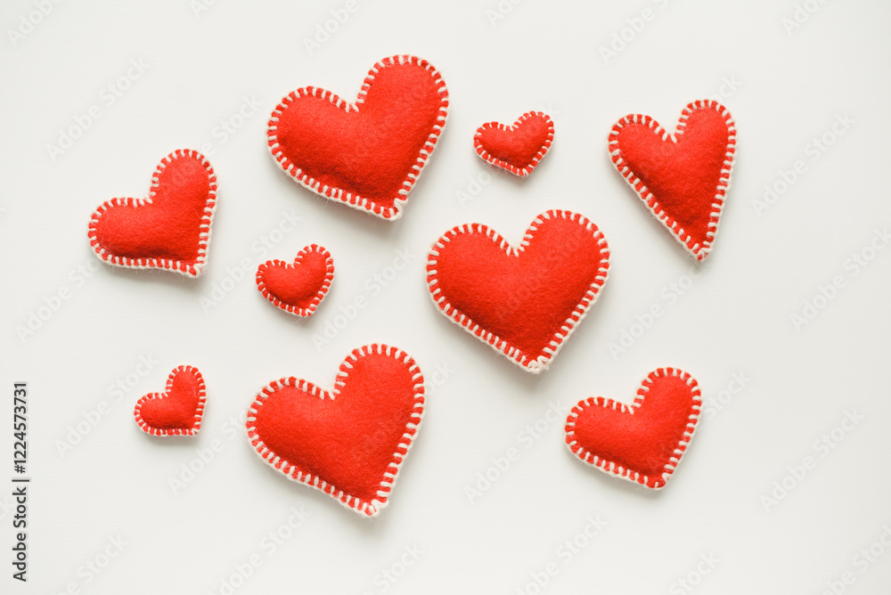 Red hearts on white background. Isolated hearts on white background. Valentine's Day background. Red felt hearts. Red hearts on white background. Isolated hearts on white background. Valentine's Day background. Red felt hearts.
