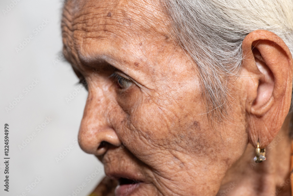 Fototapeta premium Lonely senior woman portrait sad depressed,emotion, feelings, thoughtful, senior, old woman,wait, gloomy, worried, covering her face, Human face expressions 