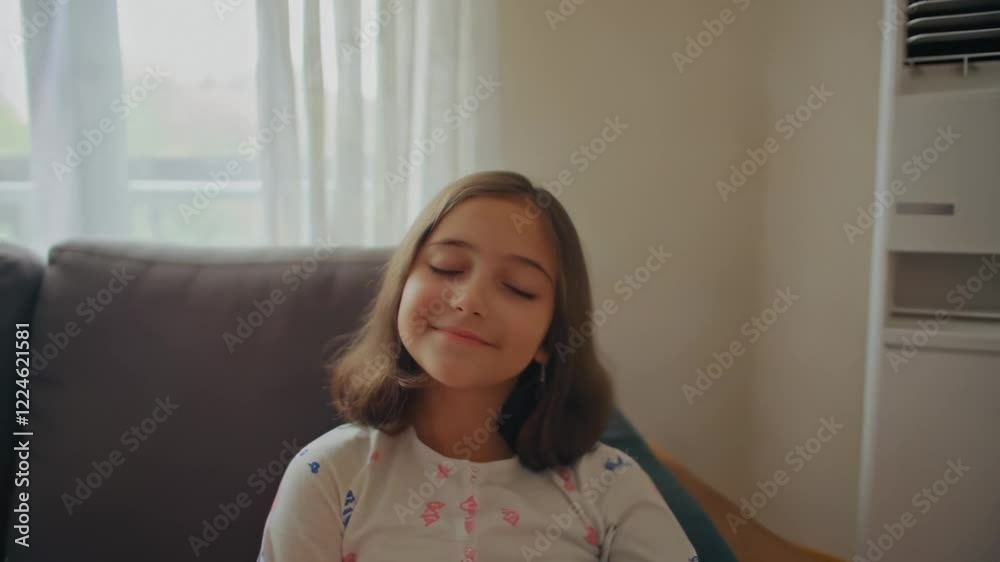 Young girl relaxing with eyes closed on sofa Young girl relaxing with eyes closed on sofa