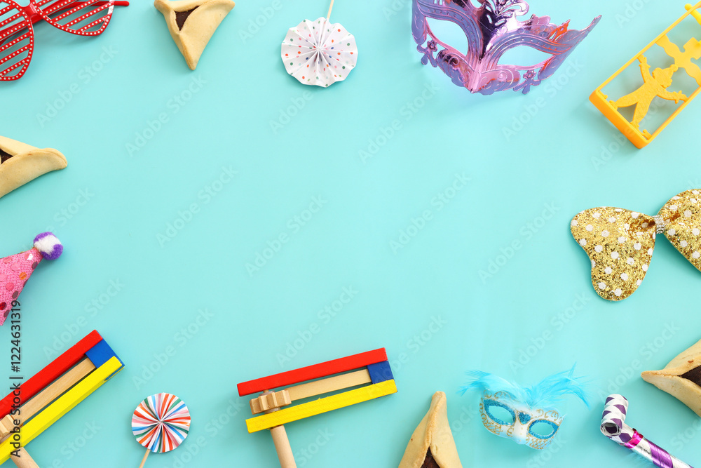 Obraz premium Purim celebration concept (jewish carnival holiday) over blue background