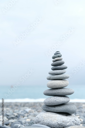 Canvas Print stack of stones on beach