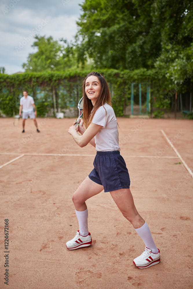 Confident female tennis player posing outdoors Confident female tennis player posing outdoors