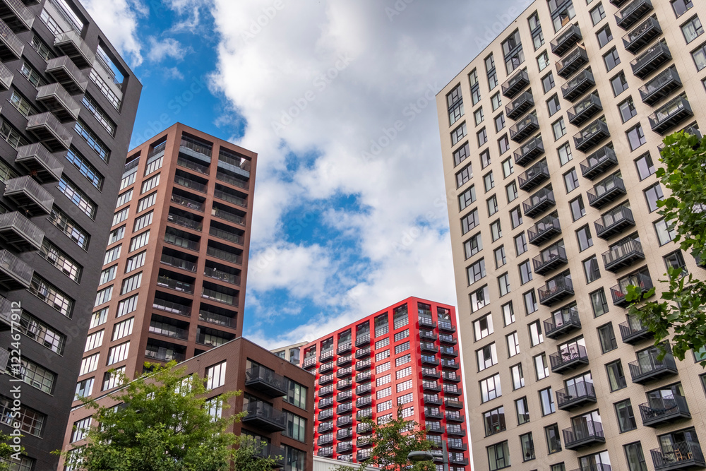 Leamouth Peninsula, London, showcases a blend of innovative residential and commercial developments surrounded by the Thames. Modern apartment blocks, cultural spaces, and landscaped paths define thi