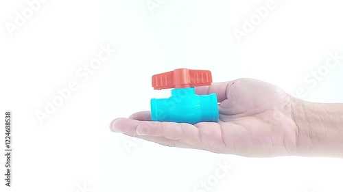 Hands holding PVC ball valve on isolated white
