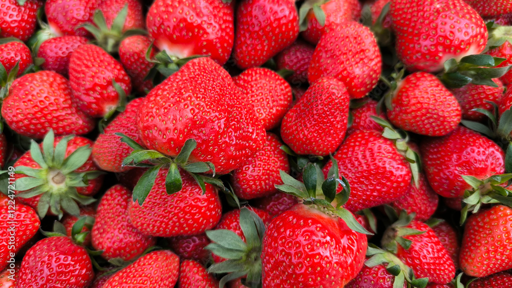 pile of ripe strawberries in the wooden box pile of ripe strawberries in the wooden box