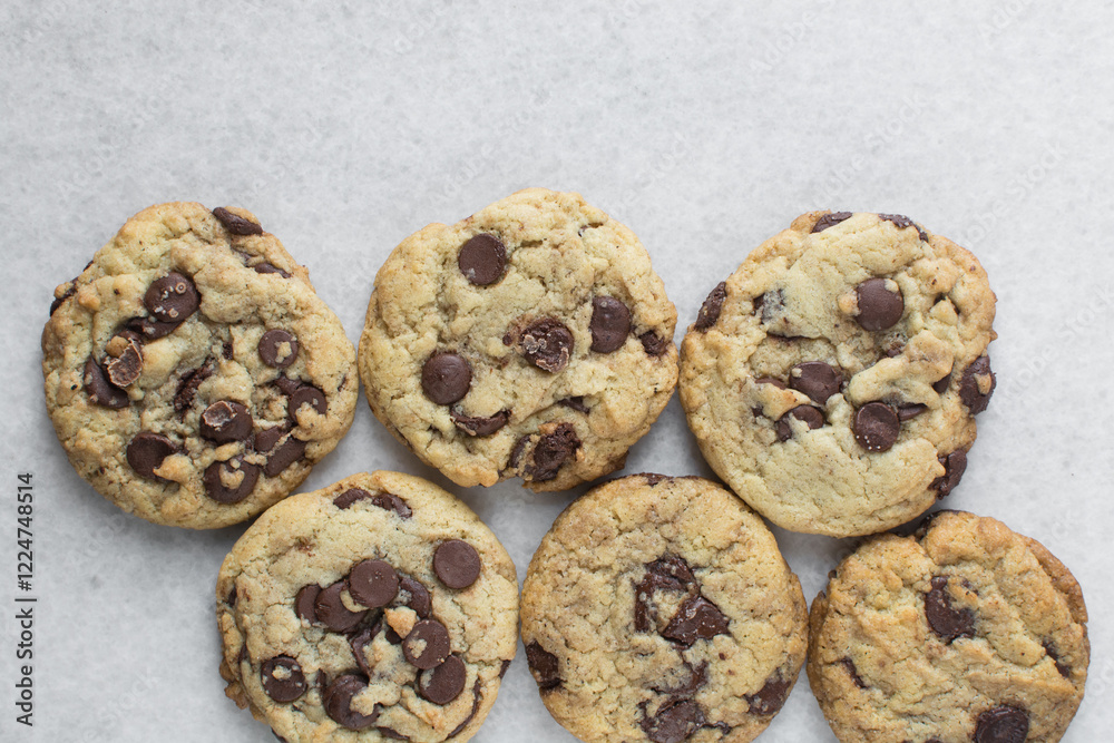 Overhead view of chocolate chip cookies, top view of homemade chocolate chip cookies on a white background Overhead view of chocolate chip cookies, top view of homemade chocolate chip cookies on a white background