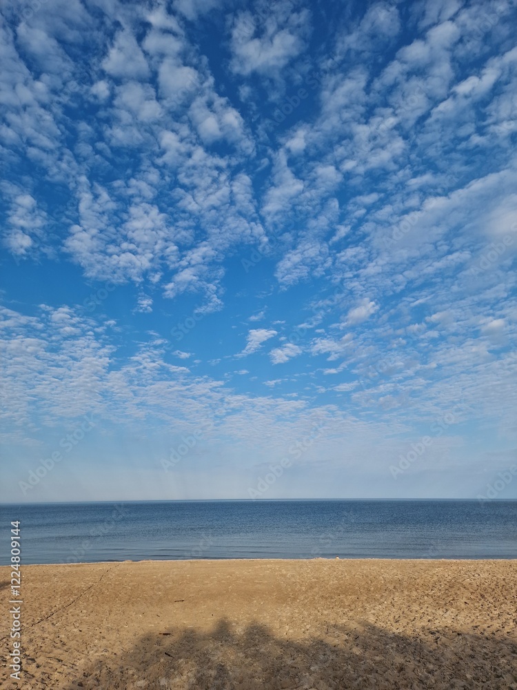 Tranquil Beachscape Under a Vast Blue Sky, Baltic Sea Tranquil Beachscape Under a Vast Blue Sky, Baltic Sea