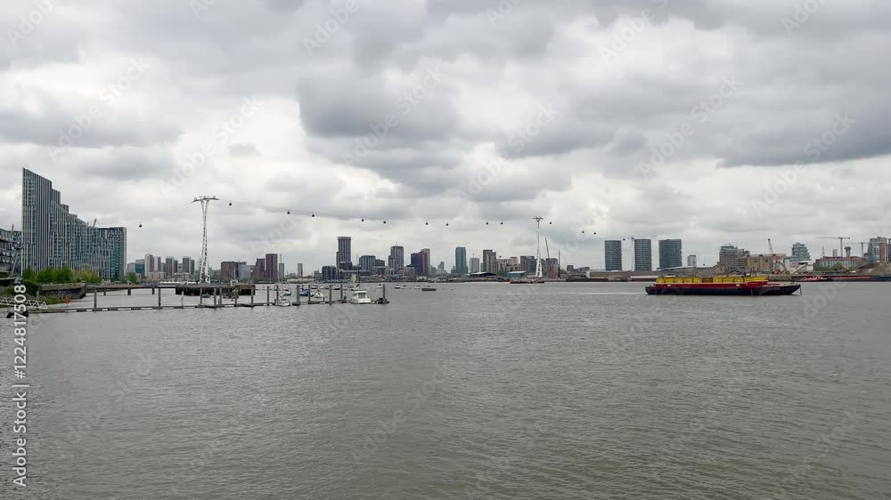 Thames river and many modern buildings in London. It is a view from Greenwich area. Thames river and many modern buildings in London. It is a view from Greenwich area.