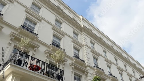 Bottom view of traditional, historical, typical buildings in London. It shows British architectural style.