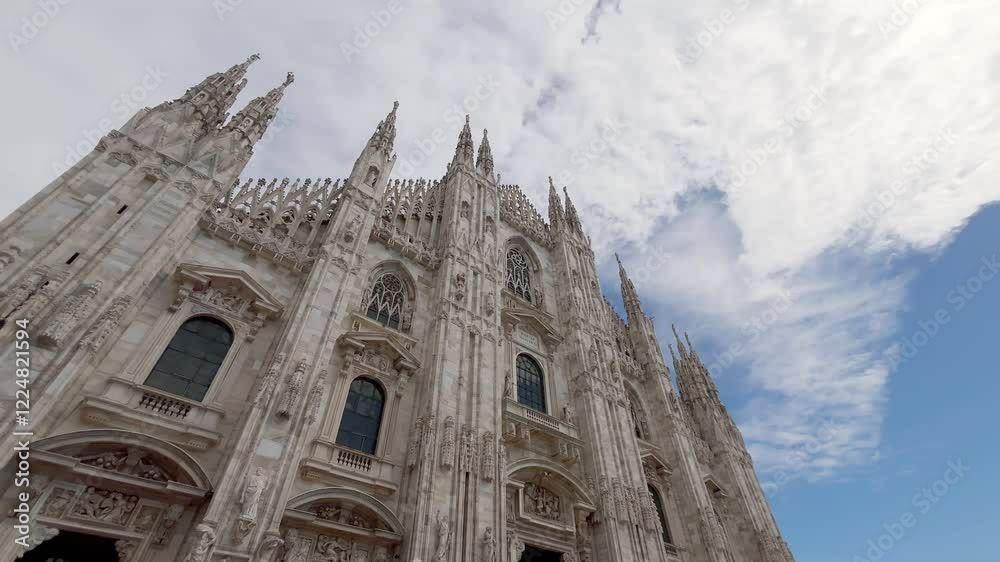 Bottom view of famous, iconic and historical church called Duomo in Milan. Classical architecture style.