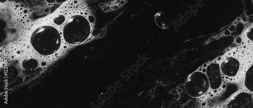 Water bubbles overlay texture with three-dimensional appearance on black background photo