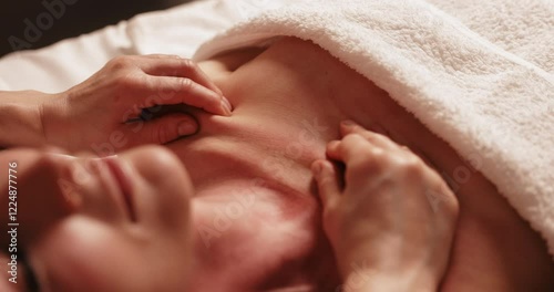 Skin anti aging massage concept. Close up of masseuse massaging mid adult woman