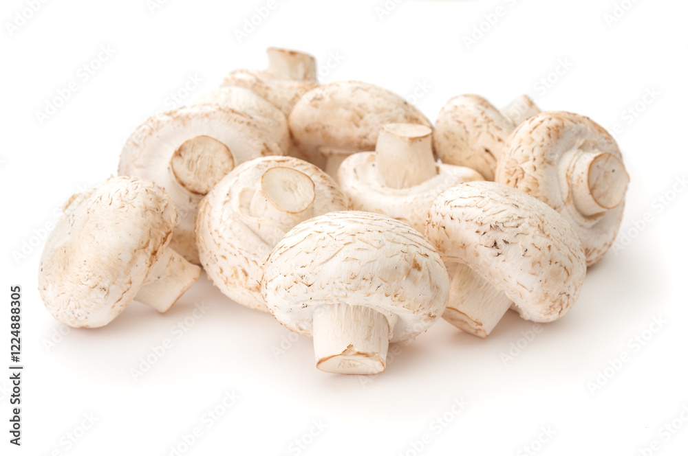 Heap of fresh whole champignons close up on a white background Heap of fresh whole champignons close up on a white background