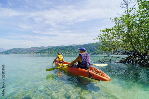 person kayaking in the sea photo