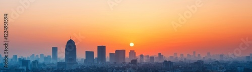 Wallpaper Mural A stunning skyline at sunset, showcasing silhouetted buildings against a gradient of warm orange and cool blue hues. Torontodigital.ca