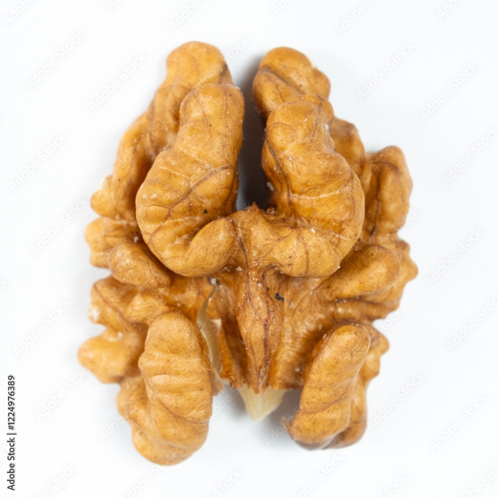 Macro peeled walnut, kernel, white isolate background, top view. Macro peeled walnut, kernel, white isolate background, top view.