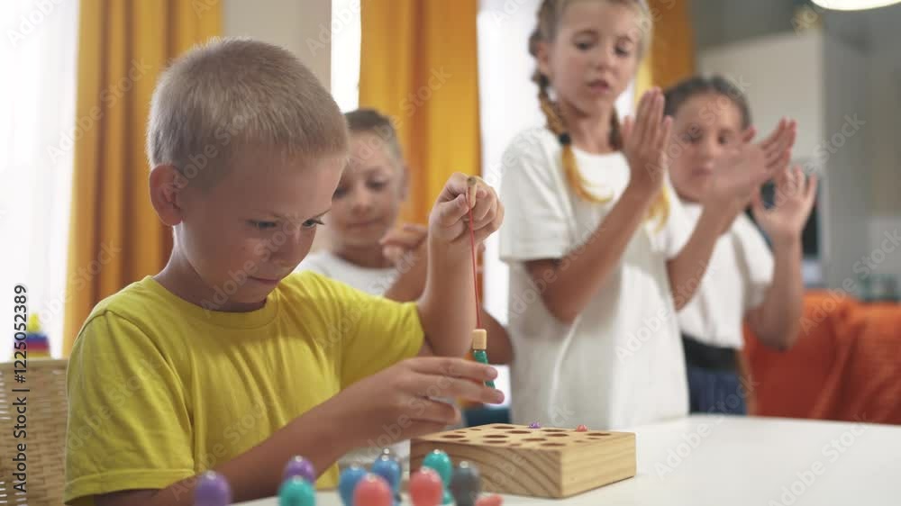 child son group playing fishing. a group of children collect building blocks in a kindergarten indoors. children in kindergarten play with toys lifestyle. happy family kid dream concept child son group playing fishing. a group of children collect building blocks in a kindergarten indoors. children in kindergarten play with toys lifestyle. happy family kid dream concept