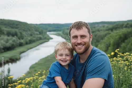 A heartwarming portrait of a father and son enjoying quality time together on a picturesque riverbank, surrounded by lush greenery and blooming flowers that symbolize their bond. photo