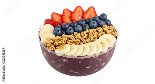 A vibrant acai bowl topped with fresh strawberries blueberries banana slices and crunchy granola in a clear bowl