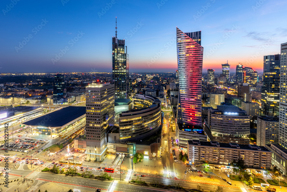Naklejka premium Warsaw skyline skyscraper in downtown by night in Warsaw, Poland