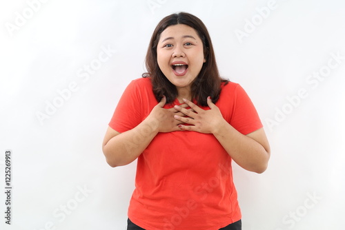 Принти на полотні Image of surprised and grateful asian woman receive gift, holding hands on chest with flattered smile, saying thank you, being praised, standing over white background